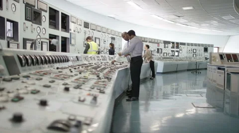 4K Workers in power plant control room, pressing switches on control desk Stock Footage 63339934