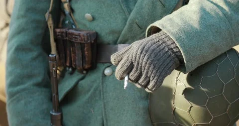 4K World War II German Soldier Holding Rifle And Smoking. Soldier Holding Weapon Stock-Footage 163696310