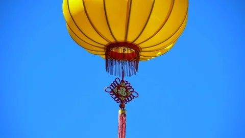 4K Yellow Chinese Lantern Close Up, Blue Sky Background Stock Footage 78653165