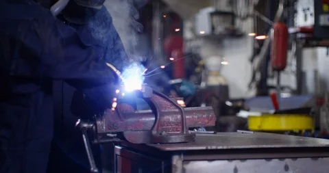 4K Young apprentice getting trained on the job in metalwork factory Video stock 111640389