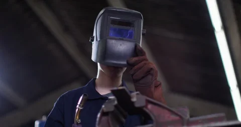 4K Young apprentice welder at work in metalwork shop Stock Footage 111654912