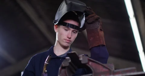 4K Young apprentice welder at work in metalwork shop Stock Footage 113106667