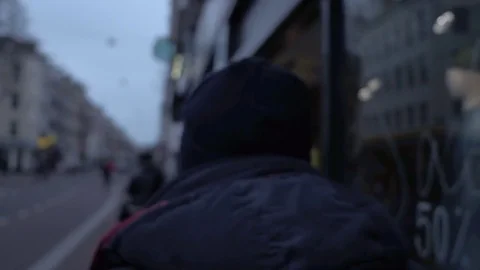 4K A young attractive man walking down the busy street of Amsterdam Stock Footage 85364983