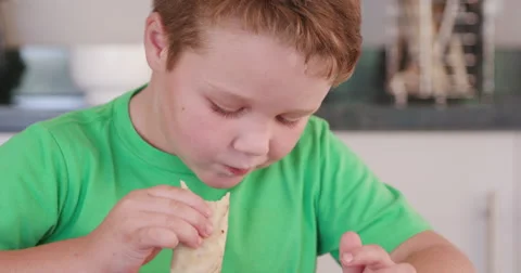 4K Young boy eating a pancake Stock Footage 64694777