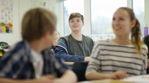 4K Young boy talking in school classroom gets applause from the other students Stock Footage 60444772