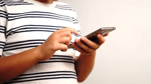 4k Young boy use a smart phone Stock Footage 90507901