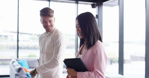 4K Young business team working in trendy office, focus on stylish Asian girl Stock Footage 118811600