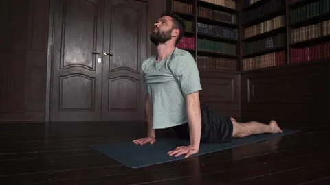 4k Young Caucasian Guy Doing Yoga At Home. Man Doing Basic Exercises Stock Footage 152570630