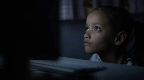 4K Young child on a computer at night in the dark Video stock 56717232