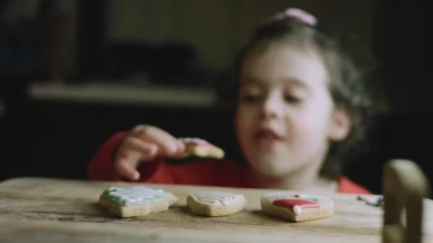 4K Young Child Reaching Toward Decorated Christmas Cookies Stock Footage 342113760
