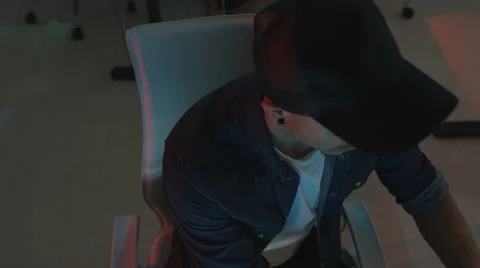 4K Young computer experts watching computer screens in dark office Stock Footage 67902696