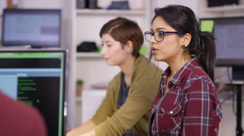 4K Young computer experts working in office with lots of computers Stock Footage