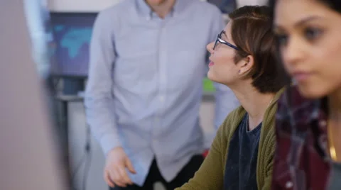 4K Young computer experts working in office with lots of computers Stock Footage 63454210