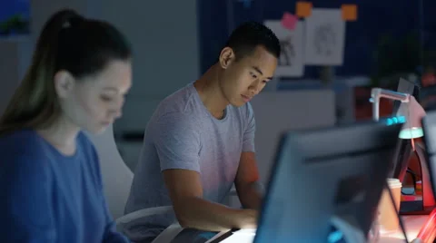 4K Young computer game designer drawing &amp; working on computer Stock Footage 67570590