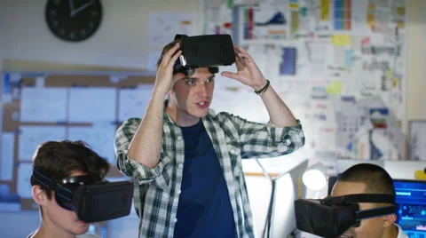 4K Young computer programmers trying out virtual reality viewers 스톡 동영상 54449165