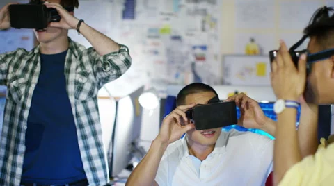 4K Young computer programmers trying out virtual reality viewers Stock Footage 54450284