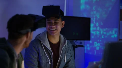4K Young computer programmers trying out virtual reality viewers Video stock 60967702