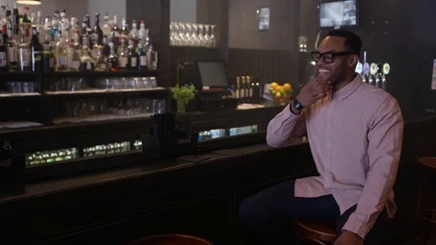 4K Young Couple Chatting &amp; Bartender Serving Drinks In Trendy City Bar Video stock 75612182