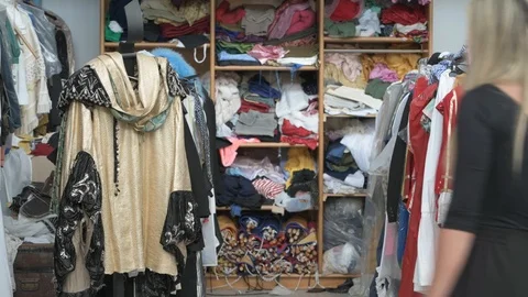 4K young couple checking clothes rack in vintage shop Stock Footage 90800878