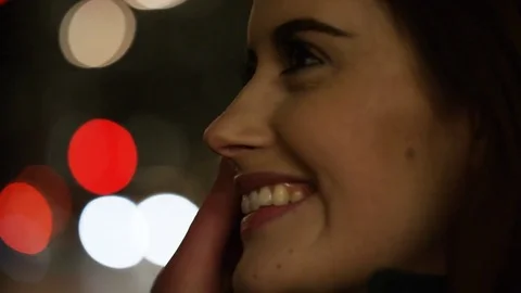 4K Young couple on a date share a kiss in the city at night Stock Footage 73855583