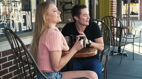 4k Young couple having coffee at cafe and happy talking Stock Footage 46992826