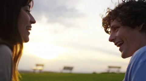 4K Young couple having fun and sharing a kiss outdoors, in slow motion Stock Footage 65135886