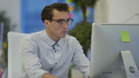 4K Young designers collaborating on a project in creative office Stock Footage 76009227