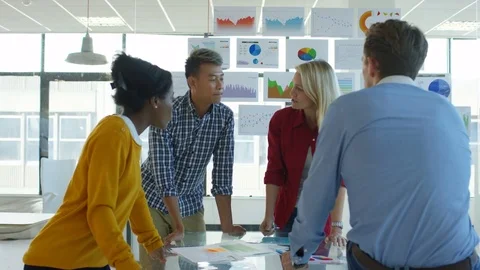 4K Young designers collaborating on a project in creative office Stock Footage 76021893
