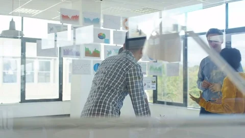 4K Young designers collaborating on a project in creative office Stock Footage 76022813