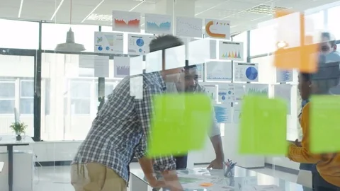 4K Young designers collaborating on a project in creative office Stock Footage 76022922