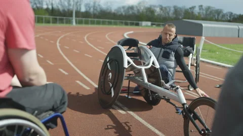 4K Young disabled adults taking advice from experienced athlete in sports sessio Stock Footage 64577113