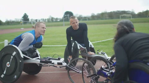 4K Young disabled adults talking to experienced athletes in sports session Stock Footage 64586478