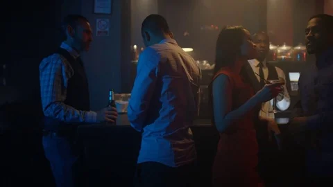 4K Young Diverse Group Chatting &amp; Socializing In City Bar Video stock 75641750