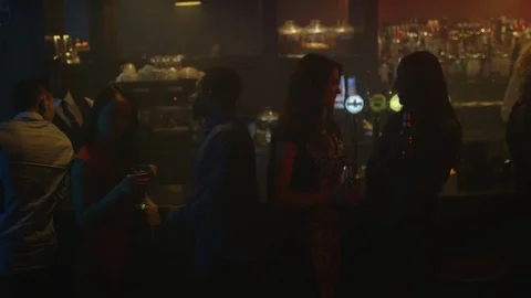 4K Young Diverse Group Socializing &amp; Bar Staff Serving Drinks In Trendy City Bar 動画素材 75796693