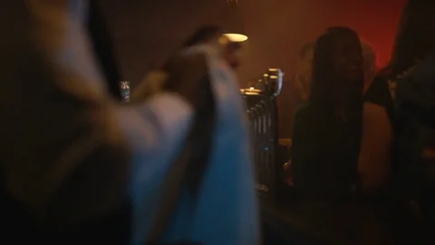 4K Young Diverse Group Socializing &amp; Bar Staff Serving Drinks In Trendy City Bar Stock Footage 75797276