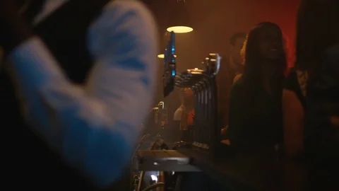 4K Young Diverse Group Socializing &amp; Bar Staff Serving Drinks In Trendy City Bar Stock Footage 75797499