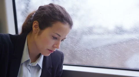4k, Young female executive working with technology on a commuter train Stock Footage
