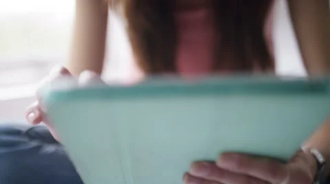 4k Young female using her digital tablet on her bed Stock Footage 56139213
