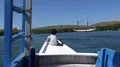 4k Young girl sitting at the bug of traditional indonesian tourist boat 4k or 4k+ Resolution
