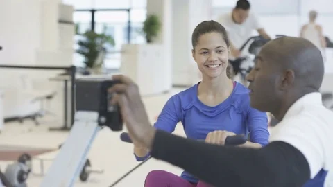 4K Young group working out in the gym with fitness instructor supervising 動画素材 75855153