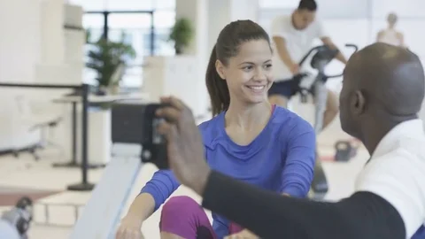 4K Young group working out in the gym with fitness instructor supervising Stock Footage 75855203