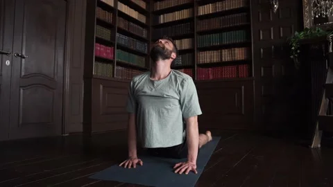 4k Young Handsome Instructor  Doing Yoga At Home. Man Doing Basic Exercises Stock Footage 152570628