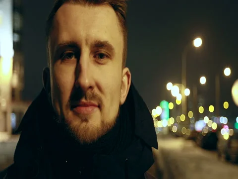 4K A young male with a beard looking at the camera. Stock Footage 73054715