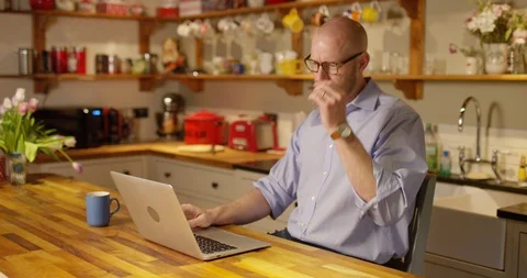 4k young man looking stressed while using a laptop to work from home Stock Footage 128392518