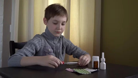 4K. Young man looking at thermometer. Stock Footage 129975272