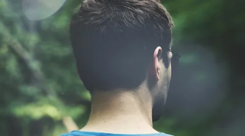 4k - Young man lost in woods with light leaks Video stock 61276804
