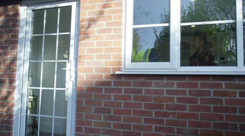 4K Young man outside his home getting planning advice from builder or architect Stock Footage 49623052