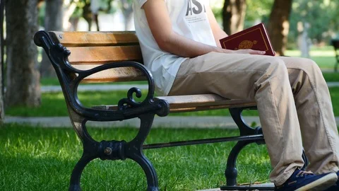 4k, Young Man In The Park With His Book Stock Footage