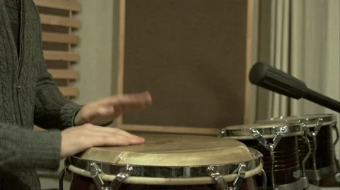 4K young man plays on percussion in a recording studio light slow motion Video stock 45814381