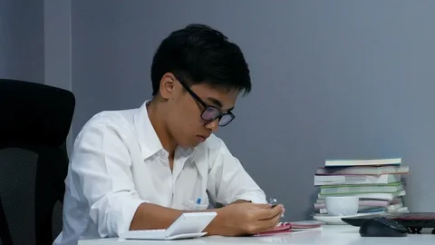 4k of young man studying and writing on notebook Video stock 93402087